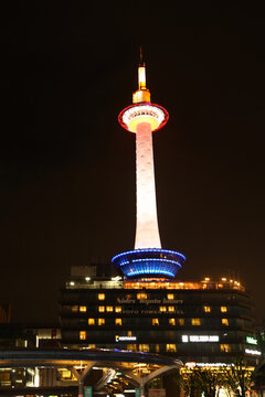 Kyoto, Japan - June 2026: Kyoto Tower illuminated at night above Kyoto Station.