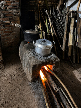 Traditional Clay Wood-Fired Stove Cooking in a Rural Kitchen