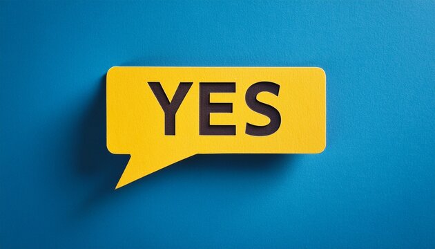 yellow paper speech bubble with yes cutout on blue background representing positive confirmation feedback
