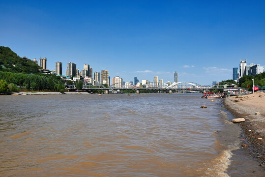 Yellow River Flowing Through Lanzhou City with Zhongshan Bridge and Urban Skyline
