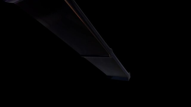 Sharp dark purple sword blade isolated on a black background for fantasy game design and concept art