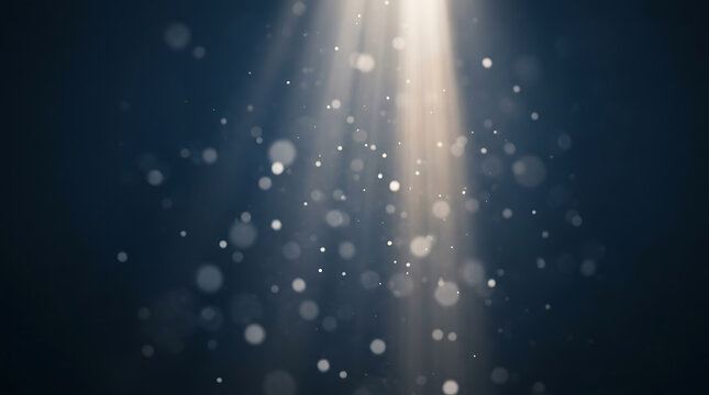 Dust motes floating in a dramatic light beam, ethereal atmosphere, abstract background with bokeh effect, perfect for atmosphere, mood, or celebration themes