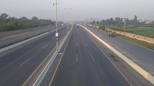 Highway traffic timelapse aerial view of a modern six lane bridge with moving cars in Lahore Pakistan