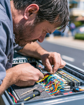 Fiber technician splicing a local network cable