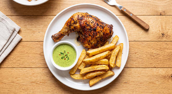 Pollo a la Brasa Traditional Peruvian Roasted Chicken with French Fries and Green Huacatay Sauce