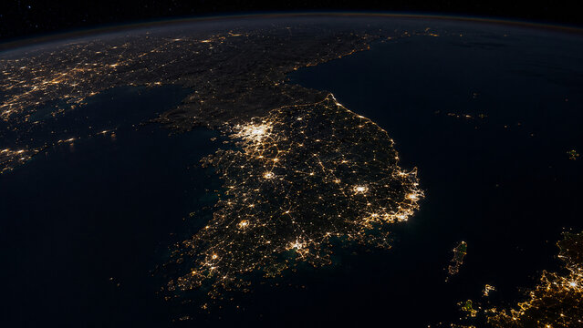 South Korea at night from space, satellite-style view of the Korean Peninsula with bright cities, coastal geography, surrounding seas and clouds