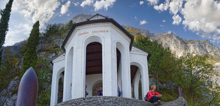 Chapel and viewpoint Santa Babara with hiker, Riva del Garda, Lake Garda North, Trento, Trentino-Alto Adige, Italy