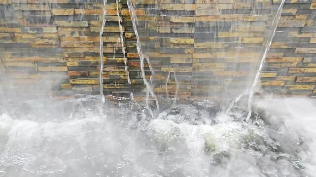 Natural Stone Cladding Waterfall Wall Feature with Dense Mist.
