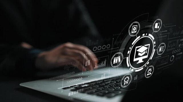Modern Laptop with Educational Graphics Representing Online Learning and Digital Training in a Dark Environment. Entropy.