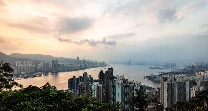 Devil's peak panoramic city skyline of Hong Kong over Victoria Harbour at sunset