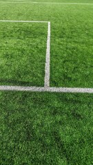 Football field corner with an orange marker flag © Andrey