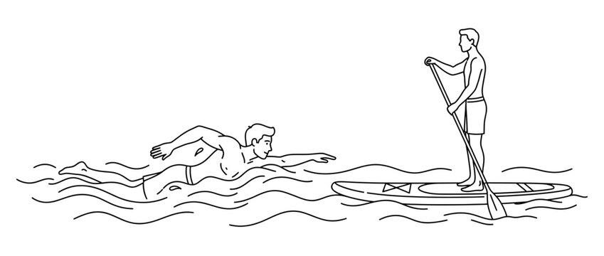 Man swimming near person on paddleboard on water