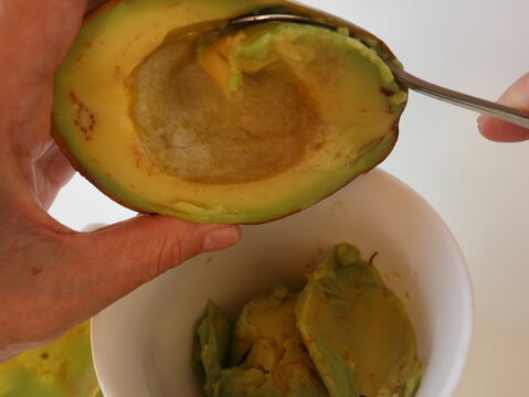 peeling fresh avocado