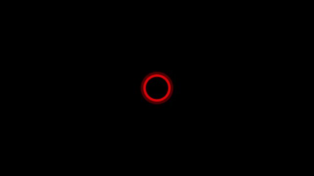 A simple of a thin red circle with a slightly lighter red glowing outline centered on a completely black background representing a loading or processing symbol