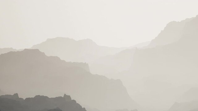 Multiple layers of hills can be seen in the distance. The sunlight creates a soft glow, illuminating the mountain ranges. The scene shows the beauty of nature at a quiet time.