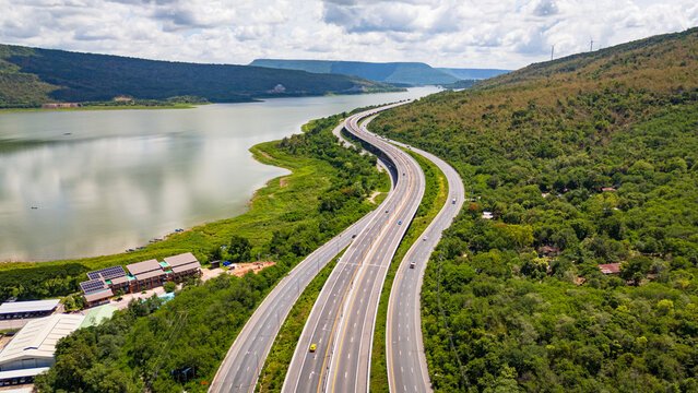 Drone shot The M6 motorway Nakhon Ratchasima Province - Bang Pa-in Lam Ta Khong River and Mountain. Motorway Korat Thailand