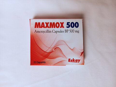 Maxmox 500 Amoxycillin capsules box on white background. BP 500 mg medicine to kill bacteria. Made in Ghana by Eskay Therapeutics Ltd. Antibiotic capsule pill. Kumasi, Ghana - January 13, 2026