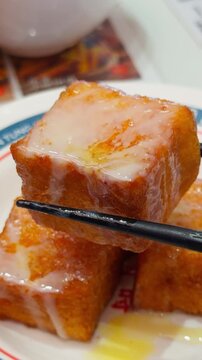 Hong Kong Style French Toast Lifted by Chopsticks Close-Up Cantonese Dim Sum