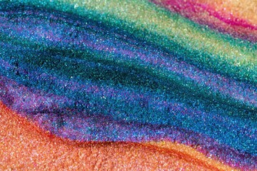 Obraz premium Abstract vibrant glitter texture with shimmering teal and orange waves for festive holiday backgrounds and creative design projects