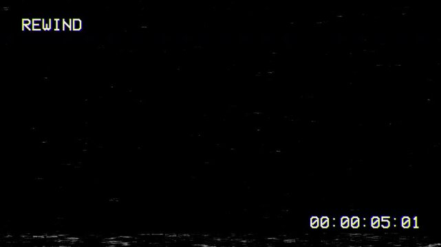 Old damaged vhs rewind effect with screen noise and timestamps
