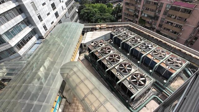 Large cooling system fans on the building's rooftop.