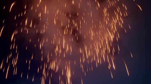 Golden firework explosion finale with bright sparks in night sky slow motion display