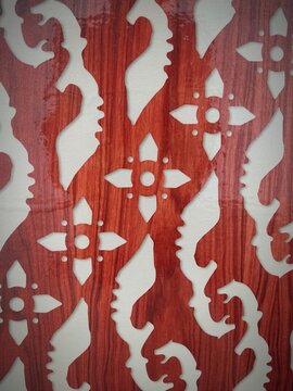 Wall decoration design with batik motif and traditional reddish kujang, typical of West Java, Indonesia