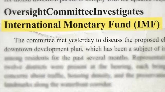 Newspaper text highlight animation of International Monetary Fund IMF phrase on vintage paper