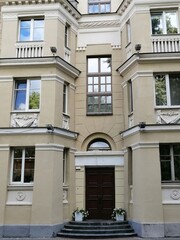 Obraz premium Vintage facade of residential or public building with ornate windows and mold