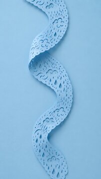 Elegant light blue papel picado ribbon with ample copy space background paper cut blank space negative spac