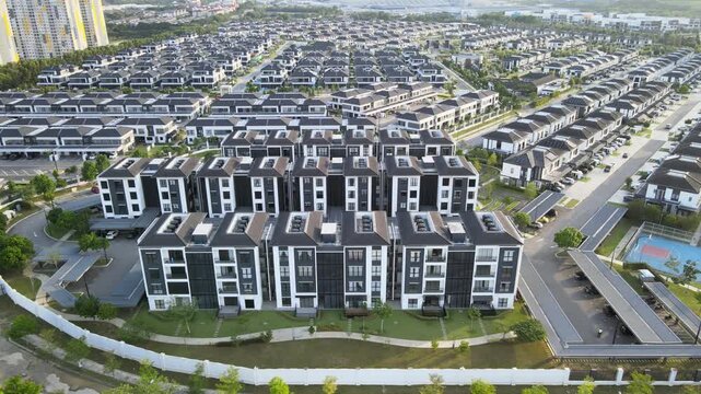 4K Drone Flight Over Modern Residential in Shah Alam captures contemporary housing, landscaped neighbourhoods, planned streets, and suburban urban growth.