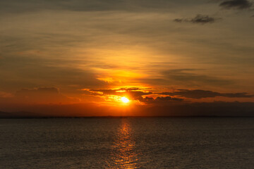 Obraz premium Sunset Over Calm Ocean Waters