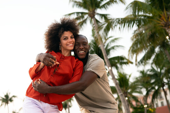 Married couple celebrates their love and bond through a quiet, intimate moment on the beach