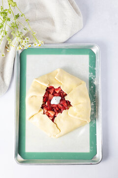 Preparing a fresh strawberry galette from scratch