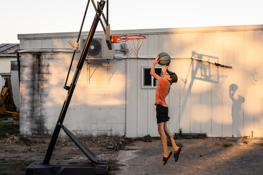 Young Athlete Practicing Basketball Alone