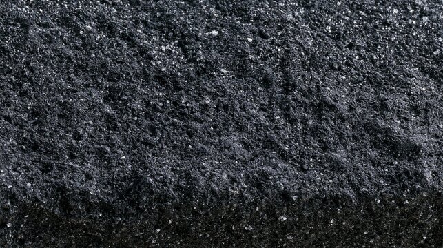 Close-up of a textured surface. the surface appears to be made up of small, irregularly shaped particles that are densely packed together.