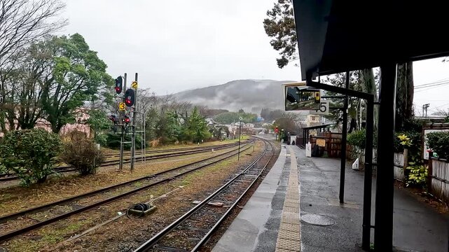 Yufuin Express Yellow Train at Yufuin  Station in Oita Japan - This train go to Hataka Statin - Travel by train on North Kyushu - Transport Footage   