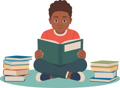 A young boy sitting cross-legged on the floor reading a book surrounded by stacks