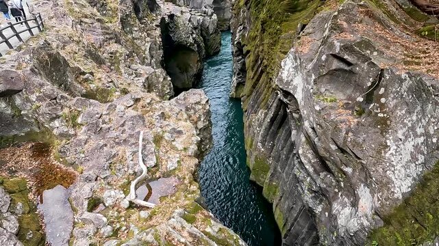 Landscape Takachiho Gorge is River canyon with waterfalls over sheer basalt cliffs viewable from rented boats and a paved path in Takachiho Miyazaki Kyushu Japan - Footage Clip Travel Nature