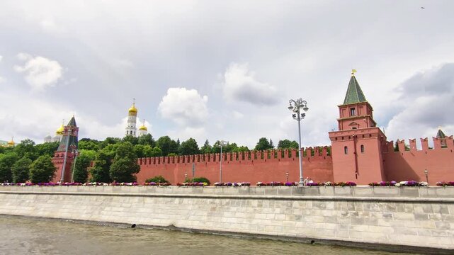 kremlin walls and towers from moscow river view represent russian government power and political authority. historic kremlin fortress symbolizes state sovereignty and federal leadership