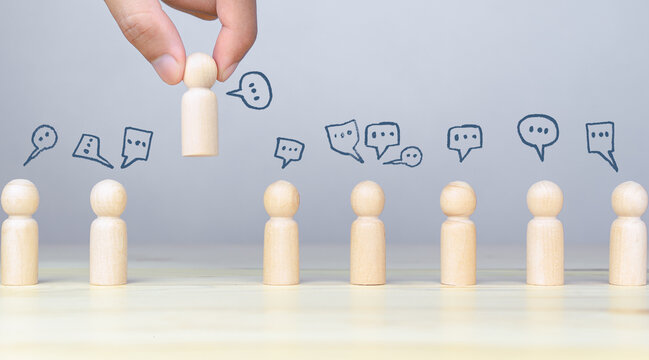 Concept of social networking, customer feedback, and brainstorming with wooden people