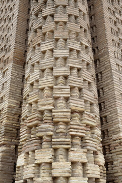 Decorative brickwork detail of the Samanid Mausoleum in Bukhara showing intricate geometric patterns. Close-up of medieval Central Asian architecture ideal for travel and heritage publications.
