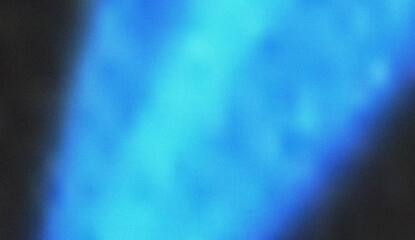 Fototapeta premium Deep ocean blue light creates a cool and calming abstract ripple effect with subtle textured grain