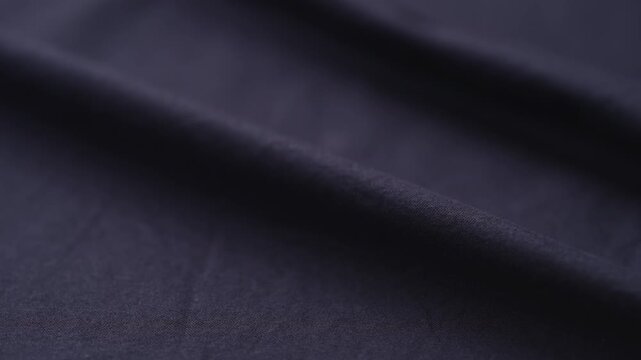 Slow motion man hand checking blue cotton shirt cloth