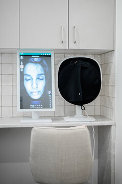 Vertical monitor displays a high-resolution facial scan of a woman