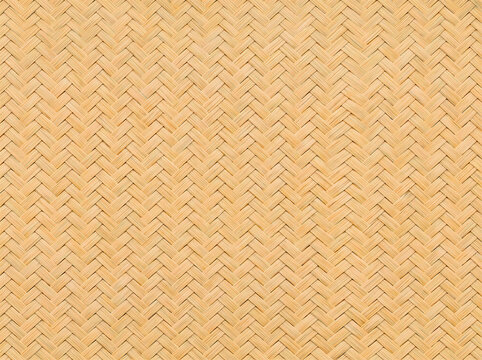 Close-up of natural bamboo woven texture, traditional herringbone basketry pattern background