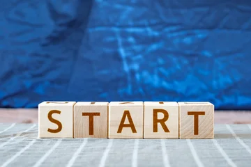 motivational word Start made of letters on wooden cubes © elenvd