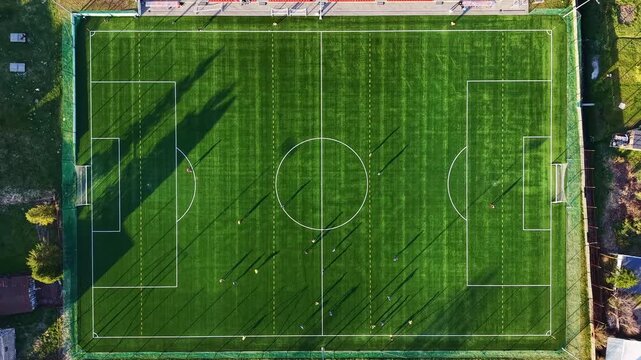 Outdoor football practice on suburban grass pitch