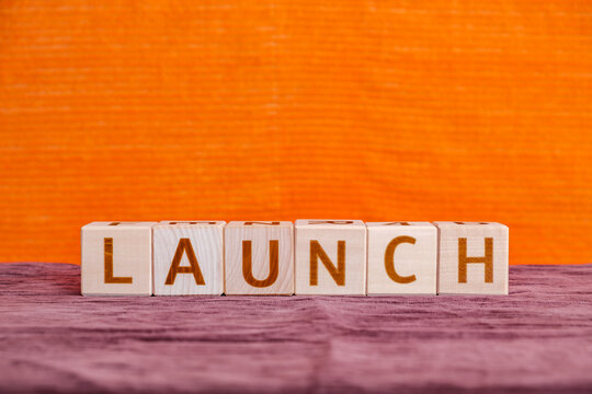 motivational word Launch made of letters on wooden cubes