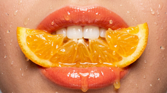 Extreme close-up of glossy coral lips biting a juicy orange slice, ideal for vitamin C skincare and vibrant citrus beverage advertising.